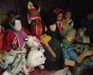 Sampling of dolls, many travel dolls
