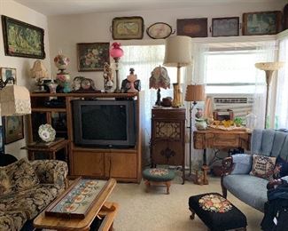 needlepoint footstools, oil lamps, floor lamps, antique trays, antique upholstered chair, New HOme sewing machine,