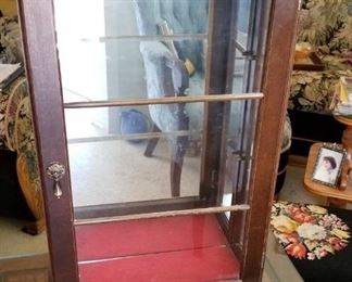 vintage display case with glass shelves