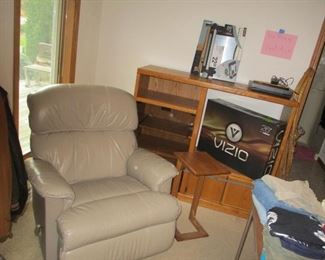 new Vizio TV in box  leather recliner.