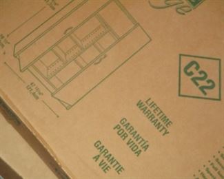 3 new in box storage cabinets