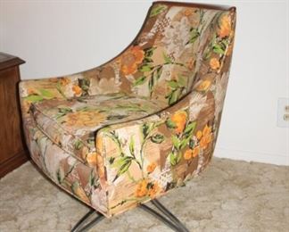 Very special flower print wide seat casual chair with hardwood top to back rest and narrow feminine detail metal legs.  Original art behind was painted specifically to match this chair. 