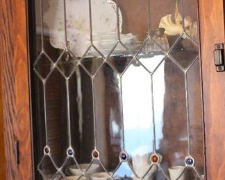 Oak wall display cabinet with lead glass doors