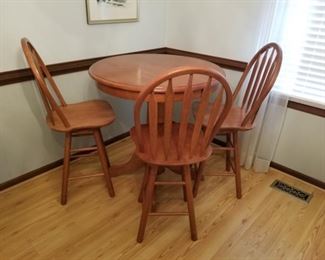 This set of one table and three swivel chairs are made of solid wood. 