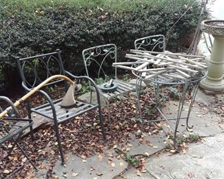Wood stars, wrought iron table and chairs, bird bath far right