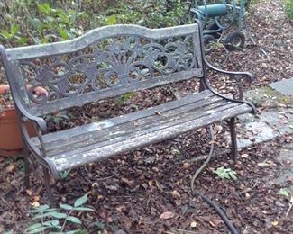 Patio bench with iron frame and wood seat