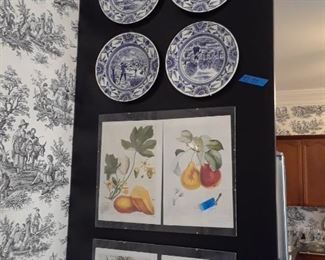 Plates and framed art used as wall decor
