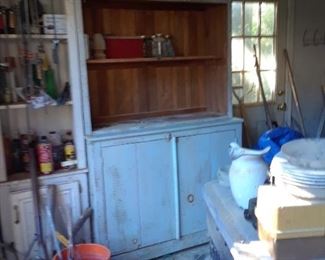 Primitive cupboard with shelves above and double doors below