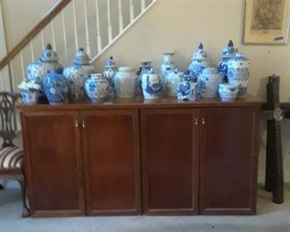 Large wood double door console with wide selection of blue and white porcelains.