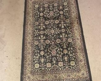 Small machine made Oriental rug