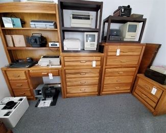 HONEY OAK DESK & 3 CHESTS with DRAWERS (THERE IS ALSO A MATCHING SINGLE HEADBOARD AND A TRIPLE DRESSER not shown in photo)...OLD APPLE COMPUTER...SLIDE PROJECTORS...DUST VAC