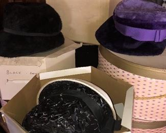 Lots of vintage hats and boxes