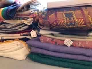 Fabrics, tablecloths, scarves, souvenier handkerchiefs, etc.