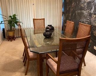 BRASS AND BEVELED GLASS TOP DINING TABLE WITH 6 CANE BACK CHAIRS/ OAXACA POTTERY VASES