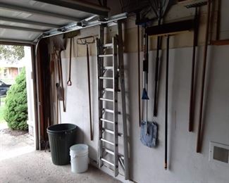Ladders and garden tools brooms and shovels