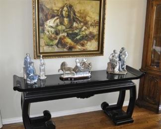 The family is keeping the painting of a woman above the table. It is not for sale.