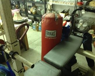 Punching bag and weight bench
