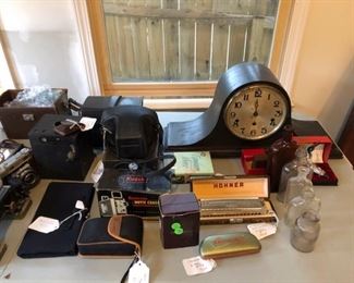 Kienzle German antique mantel clock fully refurbished, old cameras,  glassware and antique memorabila including old dater 