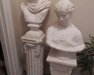 Faux busts on Grecian style plant stands
