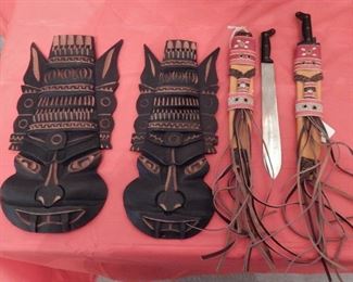 African masks wall art, small Colombian knifes in leather sheaths