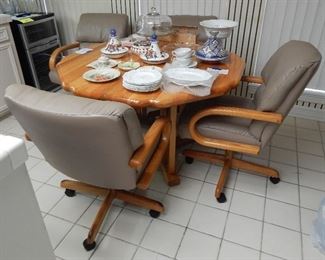 Oak table with 4 chairs on casters