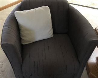 A pair of these swivel club chairs
