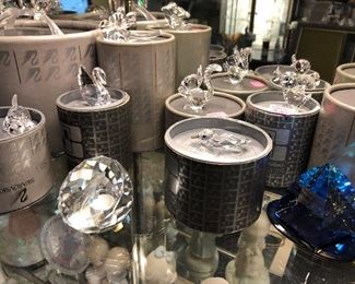 Swarovski Figurines with original boxes.  Swan, dog, golfer, squirrel, duck, bear, birds, toucan, parrots, pyramid & more