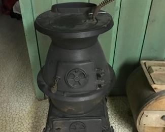 Pot belly stove 30" H to top of flue.  15" in diameter at widest point.  13" wide at top of the stove