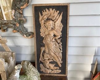 One of a pair of iron relief plaques