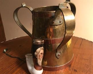 Arts and Crafts copper and brass container and German porcelain pipe piece
