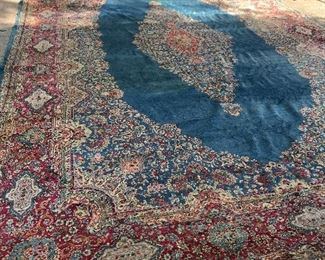 Antique Persian and Kerman Rugs in various colors and sizes