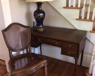 Desk, Caned Chair, Cobalt Blue & Gold Lamp