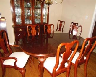 American Drew dining table (two leaves + custom pad) shown with its eight dining chairs and china cabinet