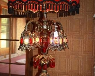 The "star" of the show. There is a pair of lamps original to the house. The shades cover one light bulb. Inside each of the bell like things are lights of different colors, and the base of the lamp also lights. It's simply amazing-tall, very heavy, and gorgeous.