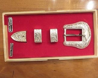 Steerling silver belt fittings in original box.