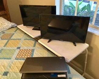 2 small tvs and an HP laptop 