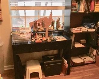 Office shelves, desk, books, puzzles, art, office supplies