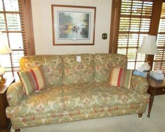 nice custom sofa, end tables, lamps, prints