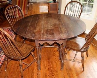 ONLINE AUCTION ITEM #6 - Gate-leg table with Pottery Barn chairs - table approximately 57.75" diameter.