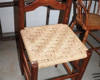 ONLINE AUCTION ITEM #20 - Three woven seat ladder back barstools - seat approximately 25” tall on 2 larger ones, 22.5” tall on smaller one.