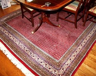 ONLINE AUCTION ITEM #24 - Large red Oriental area rug - approximately 13.5 feet x 8.25 feet.