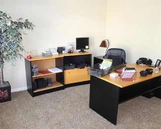 Office is full of two tone, quality desk, credenzas and file cabinet.