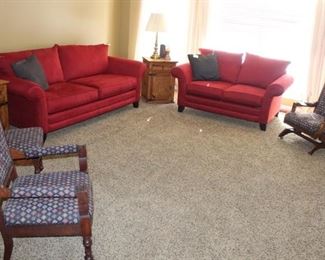 Family room has  micro suede sofas and three Victorian era parlor chairs.  