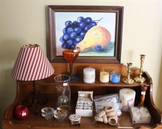 Dry sink shown with candles, napkin rings, etc.  
