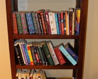 We have a pair of bookcases with lots of books.