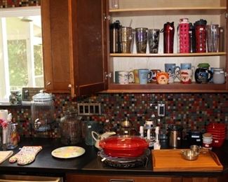 The kitchen is full with clean and practical items.  