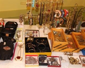 Our "goodie table" is full of costume jewelry and misc. collectibles, (Harley Davidson & Ray Bans), and some finer jewelry.