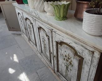 Shabby chic console with great storage is in the atrium.