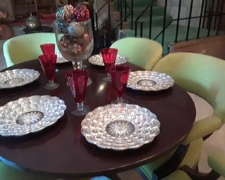 Unusual mirrored chargers, Service for 12 red stemware, chairs are priced to sell.