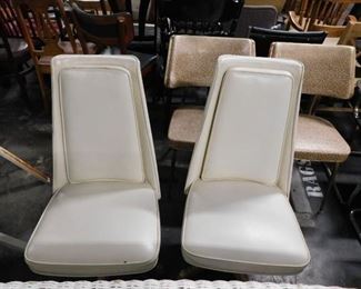 MCM cream vinyl swivel chairs with ornate gold base 